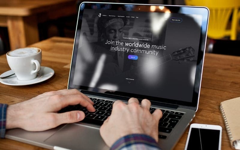 person using their laptop to visit music gateway durinf coronavirus