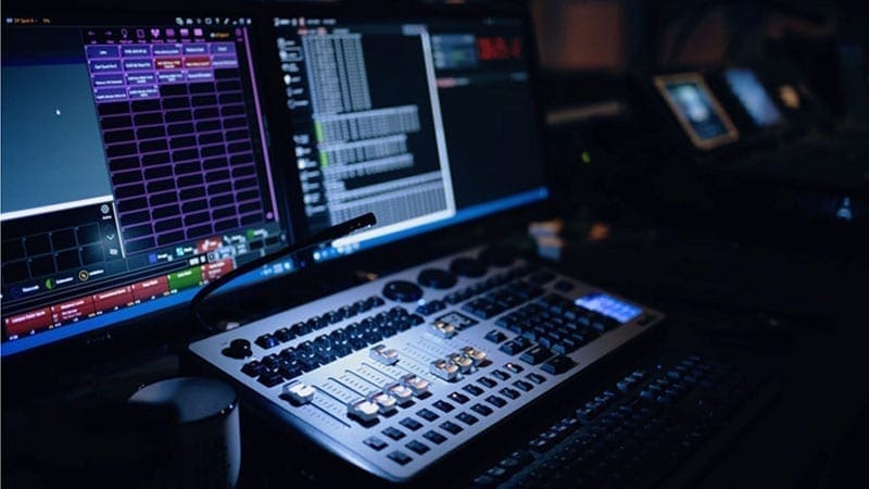 Mixing desk & computer in low lighting