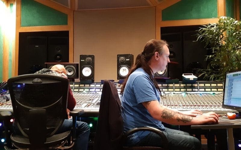Man at mixing desk inside RAK Studios