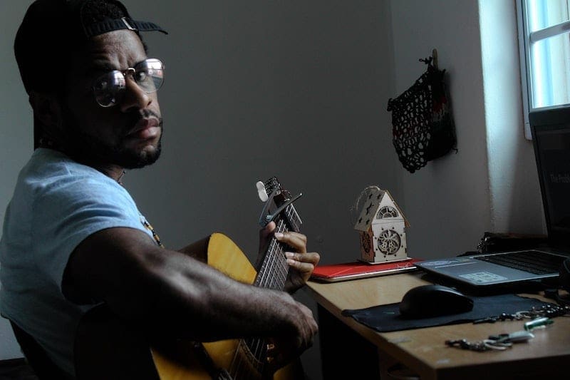 man playing guitar using band app