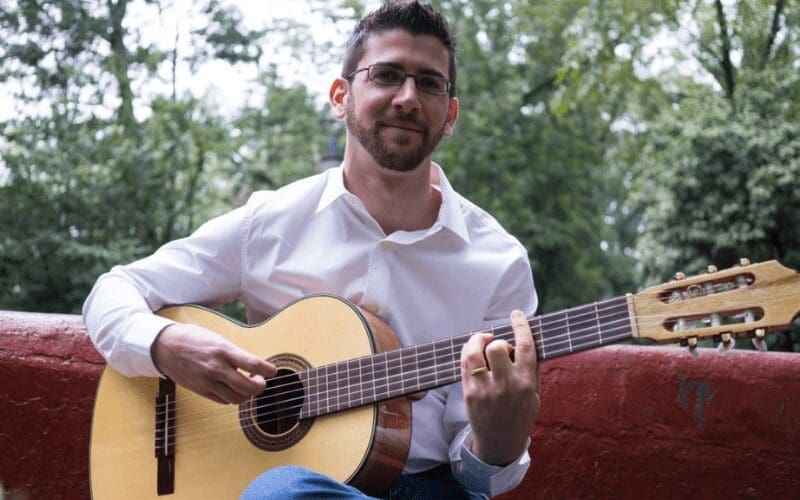 Musical U Christopher Sutton playing guitar