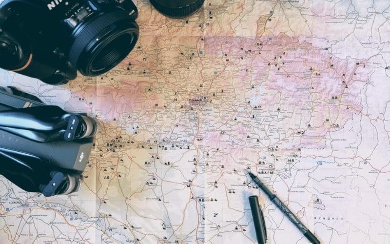 drone and camera on a map location scouting