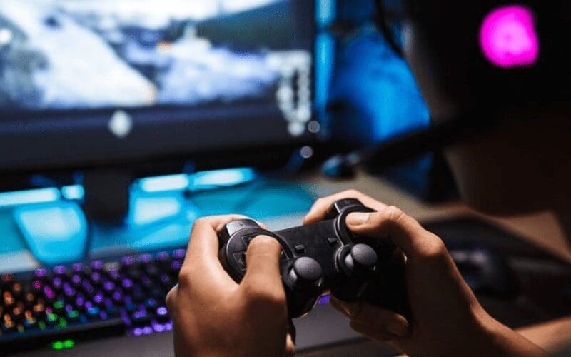 playstation controller with qa tester playing a game
