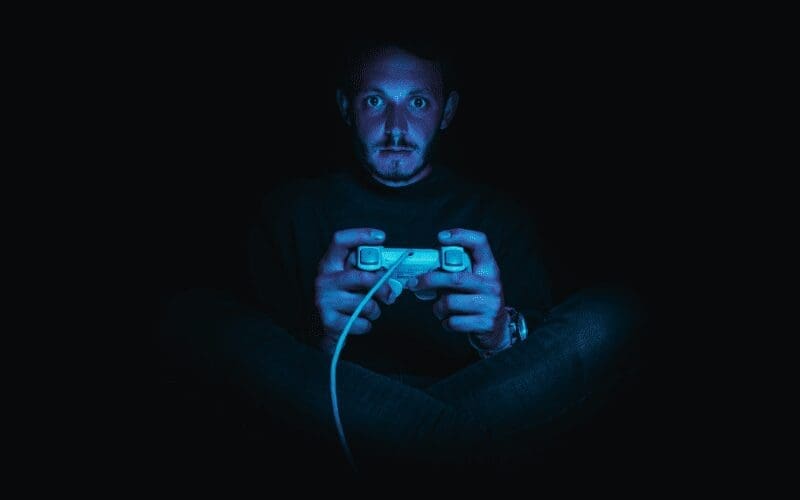 man playing console game