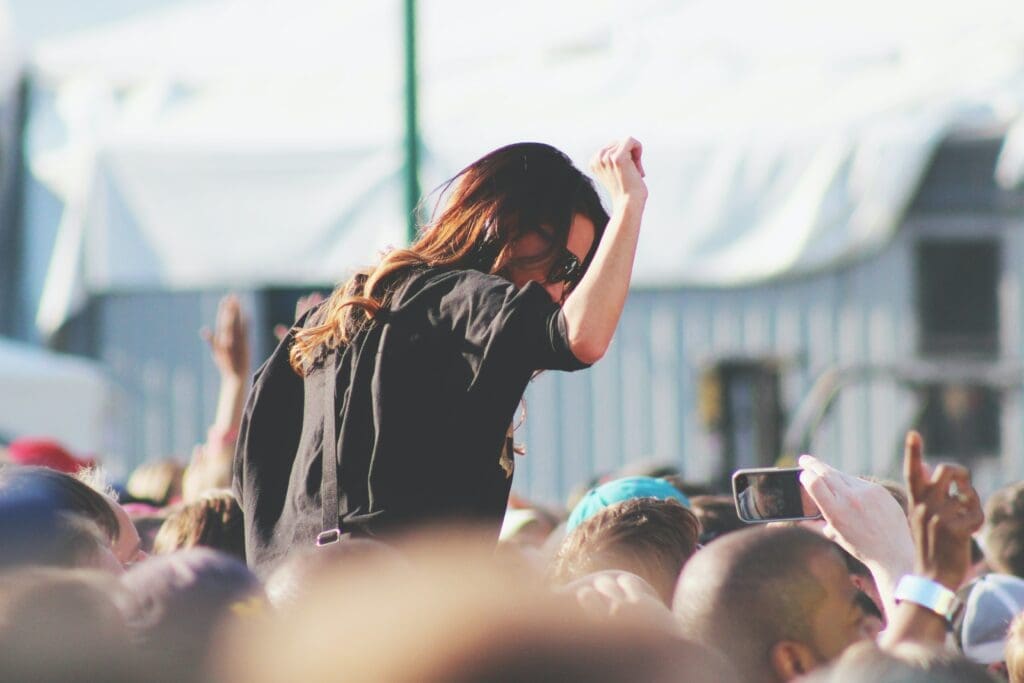 Woman on shoulders in the crowd